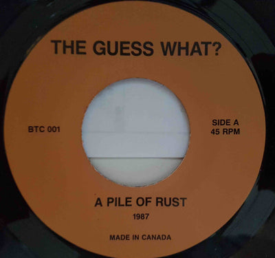 The Guess What? – A Pile Of Rust-7", 45 RPM, Single